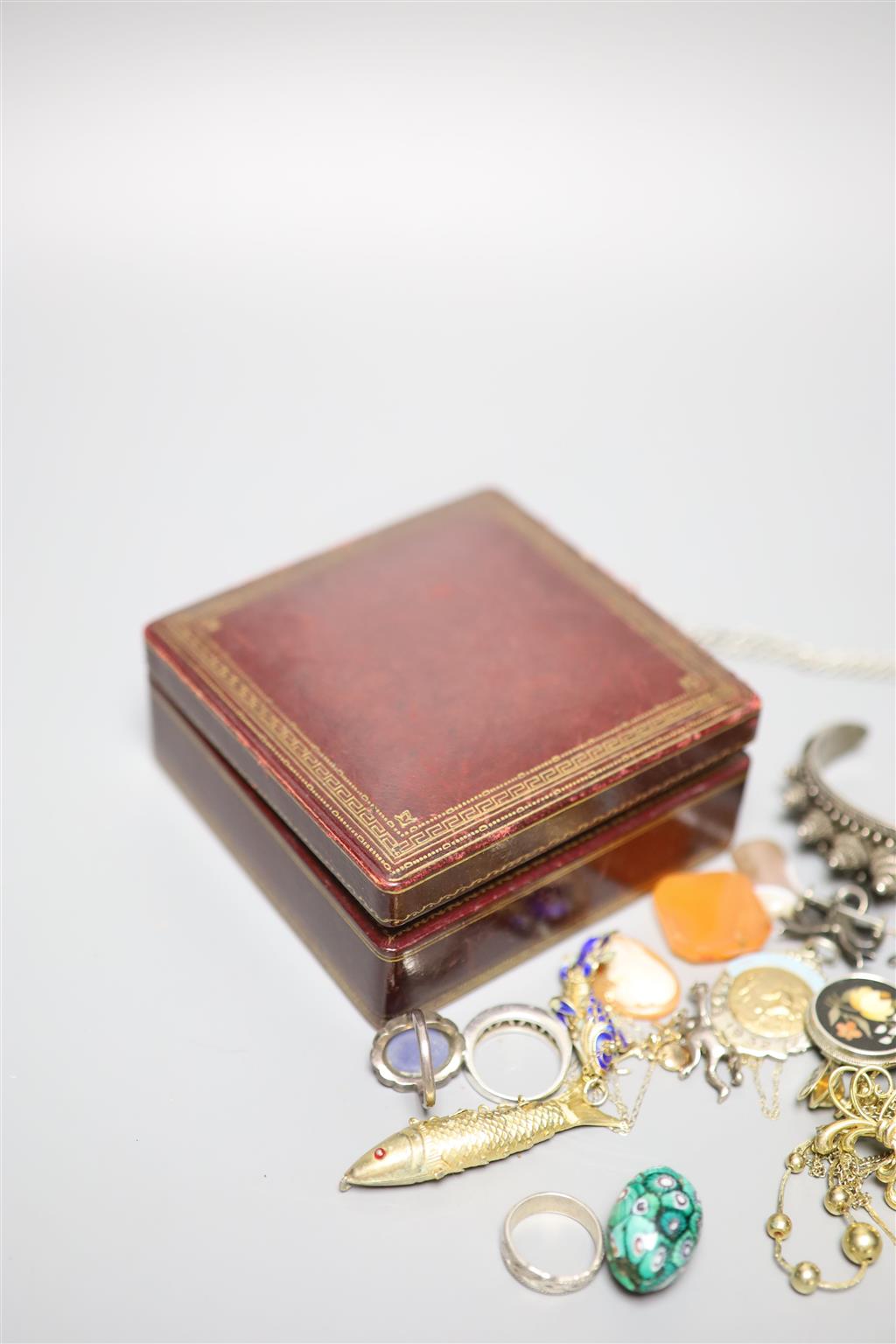 A white metal French Indonesian bangle, enamelled fish pendant and minor items.